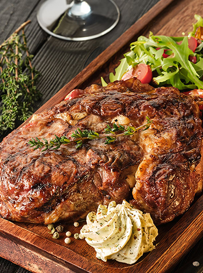 Grilled Ribeye Steak with Herbed Butter