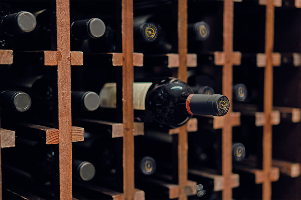 Cellar Notes - Wine Rack with vintage bottles.
